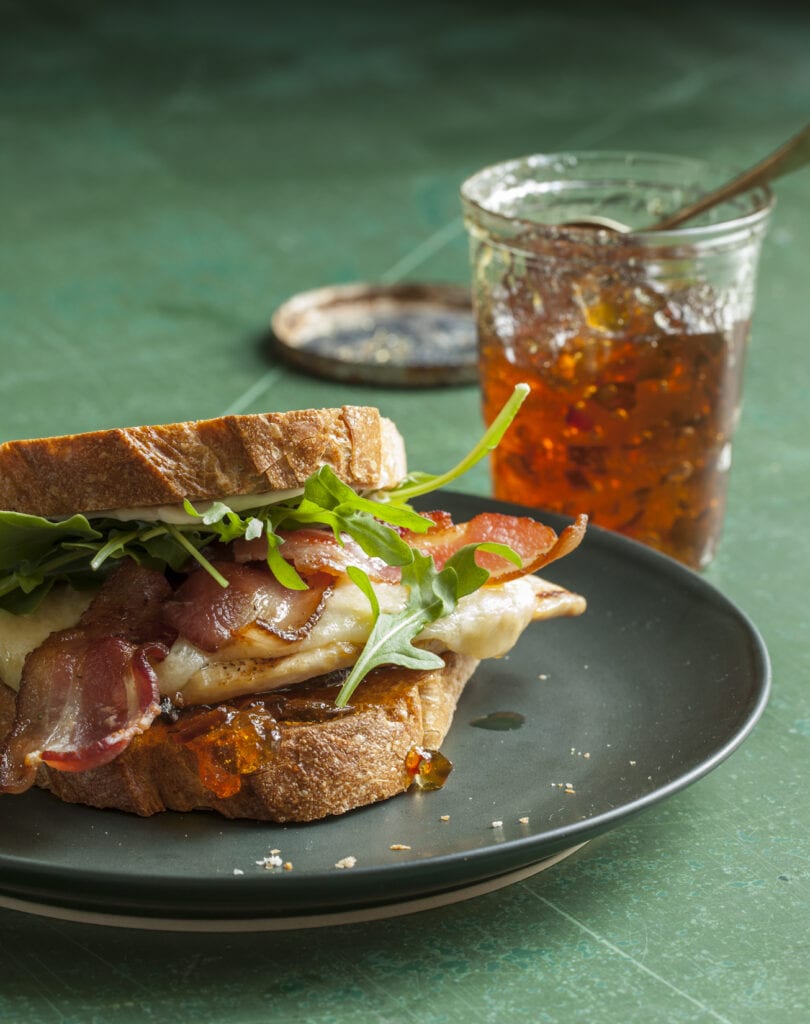 bacon chicken sandwich with pepper jelly in a jar