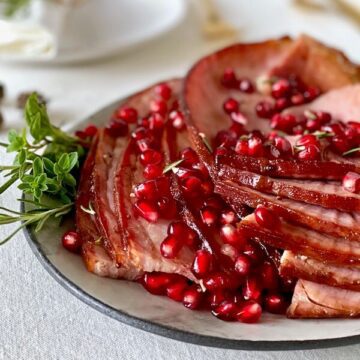 holiday ham with pomegranate on platter