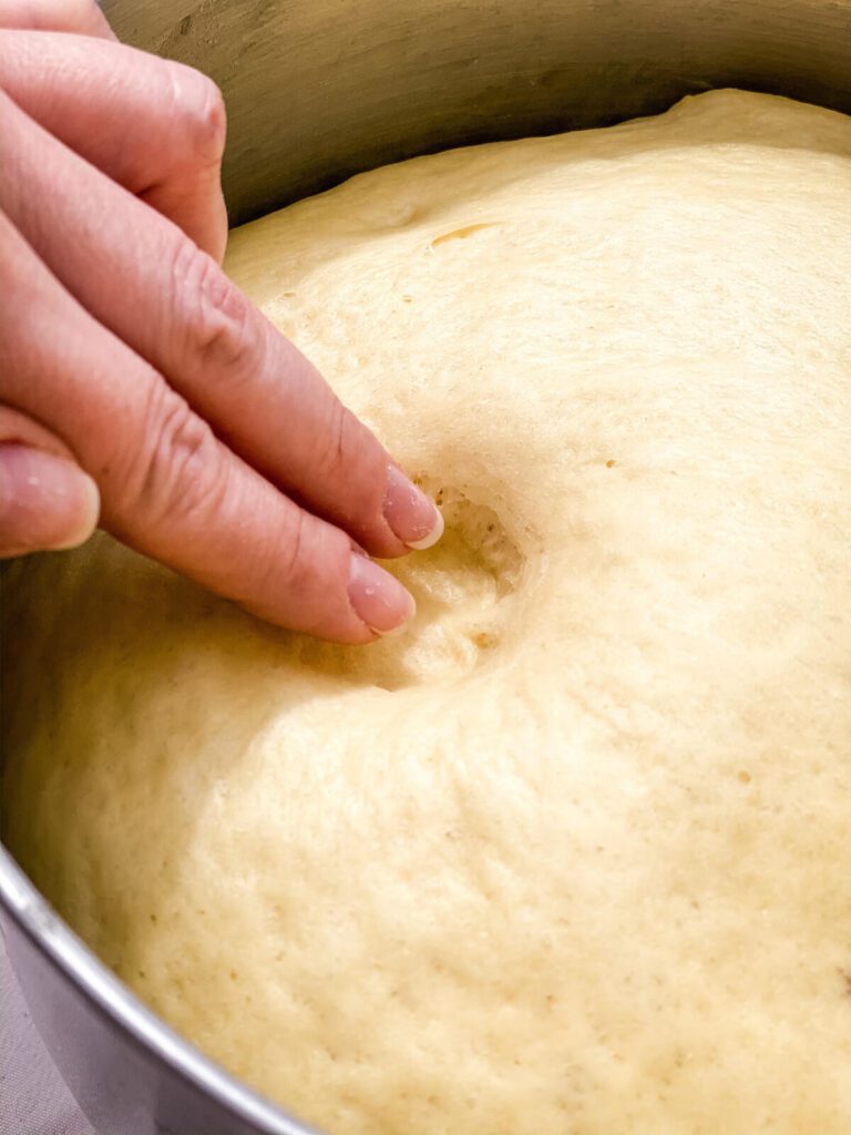 testing proofed bread dough