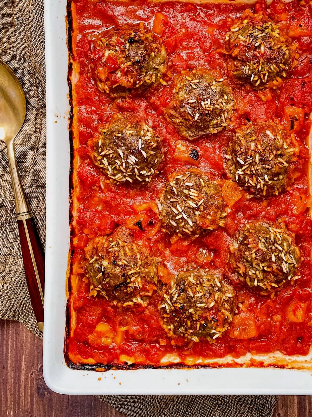 baked Moroccan meatballs in white dish