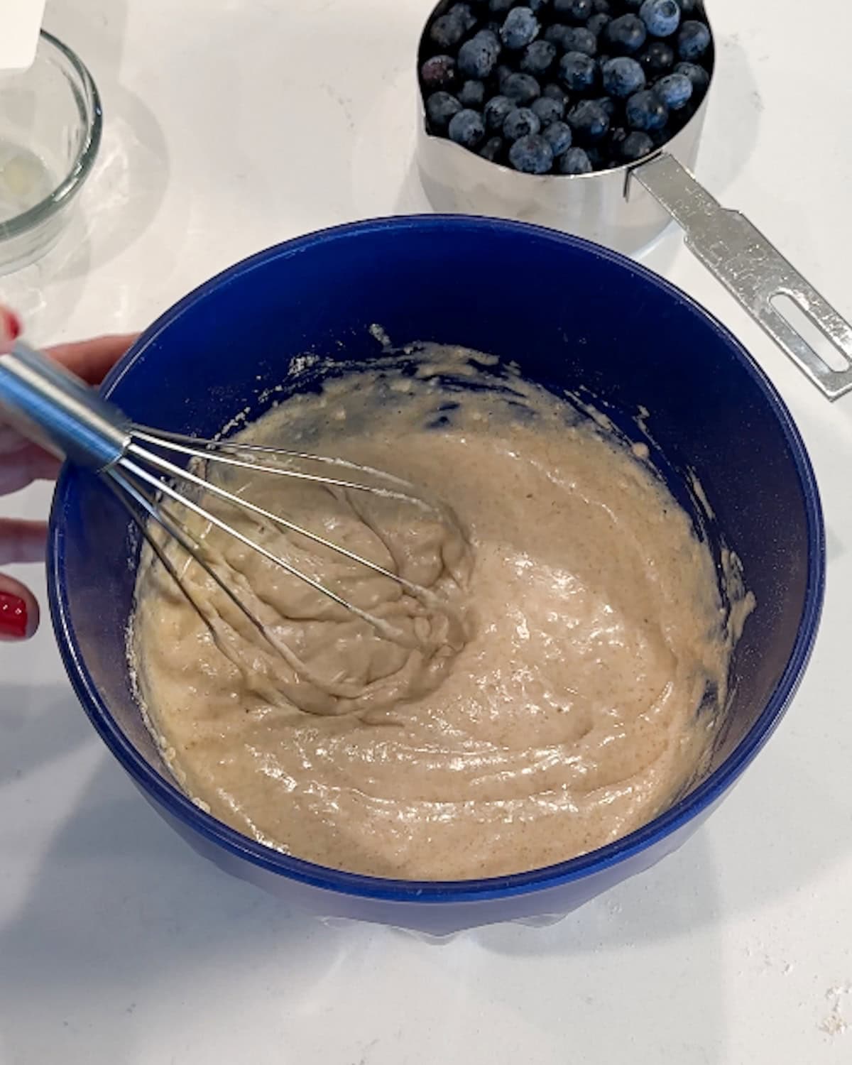 Mixed pancake batter in a bowl.