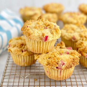 stacked rhubarb muffins on rack