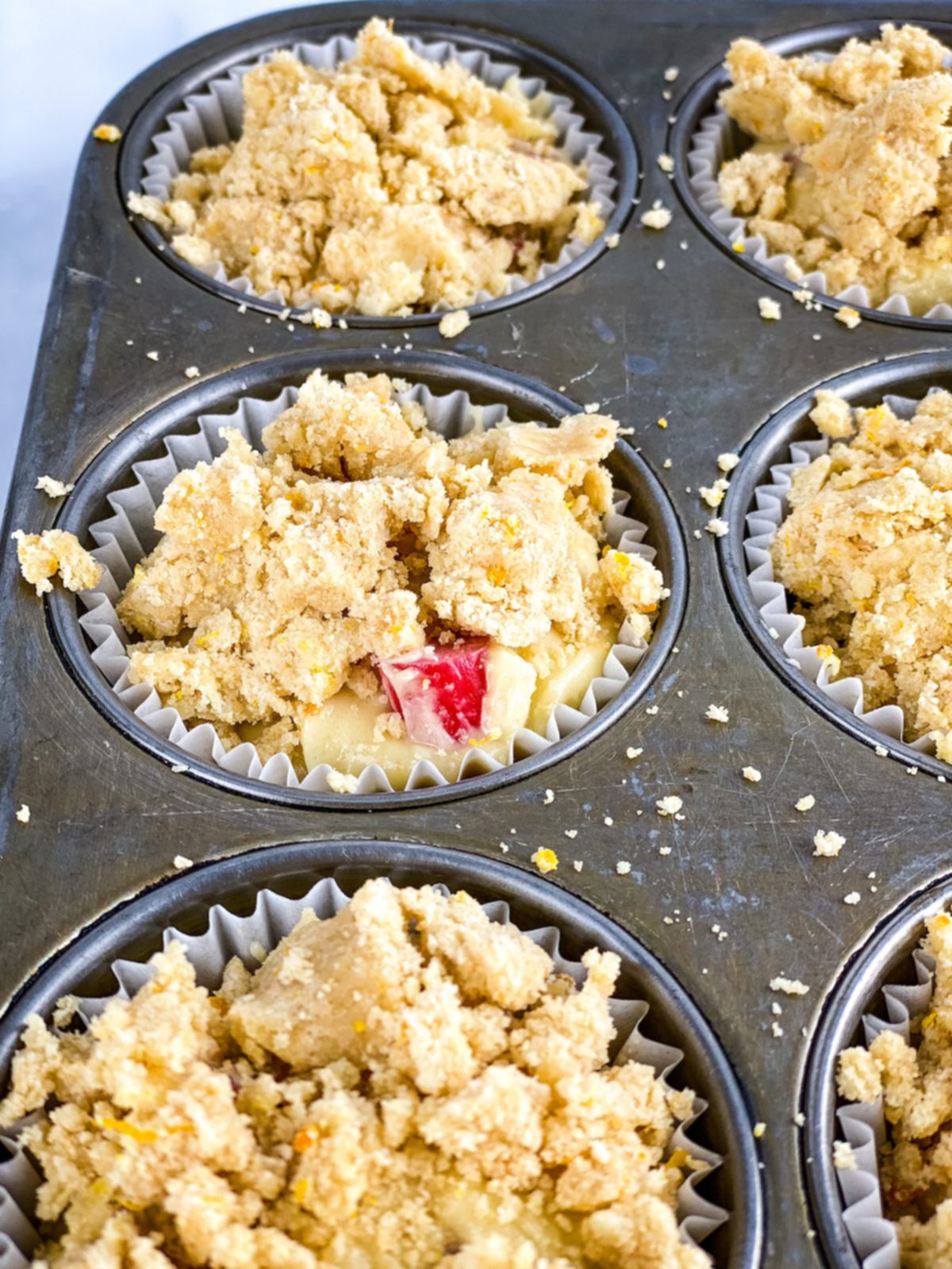 orange rhubarb muffins with streusel ready to bake