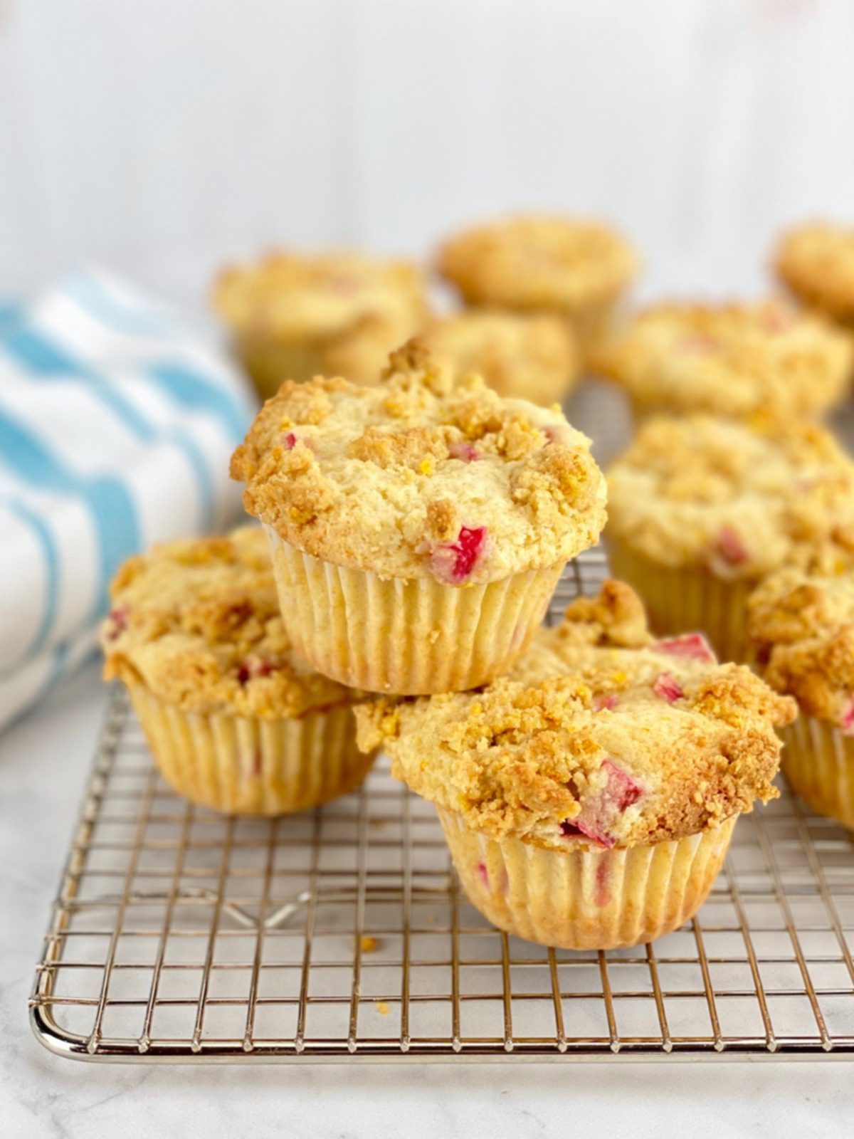 orange and rhubarb muffins with streusel on cooling rack