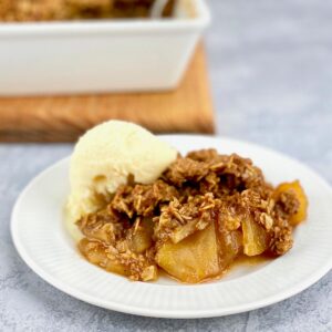 serving of apple crisp on white plate