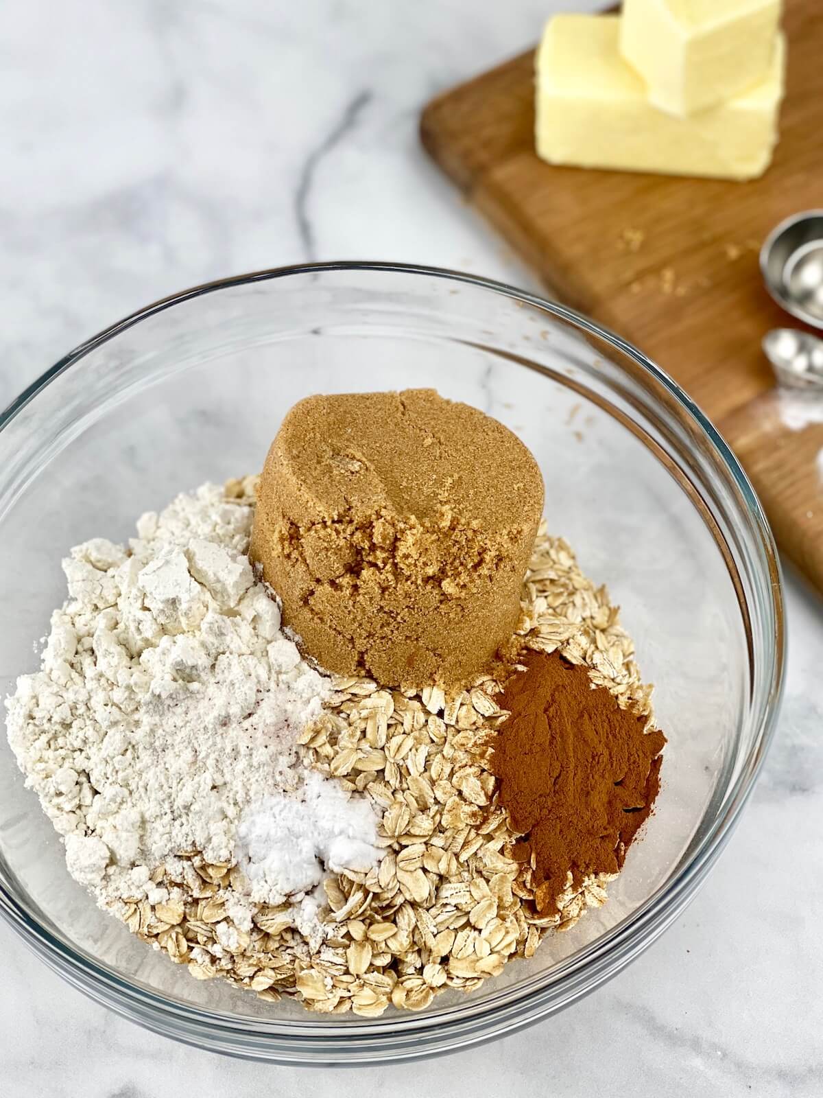 apple crisp topping ingredients in medium-size glass bowl