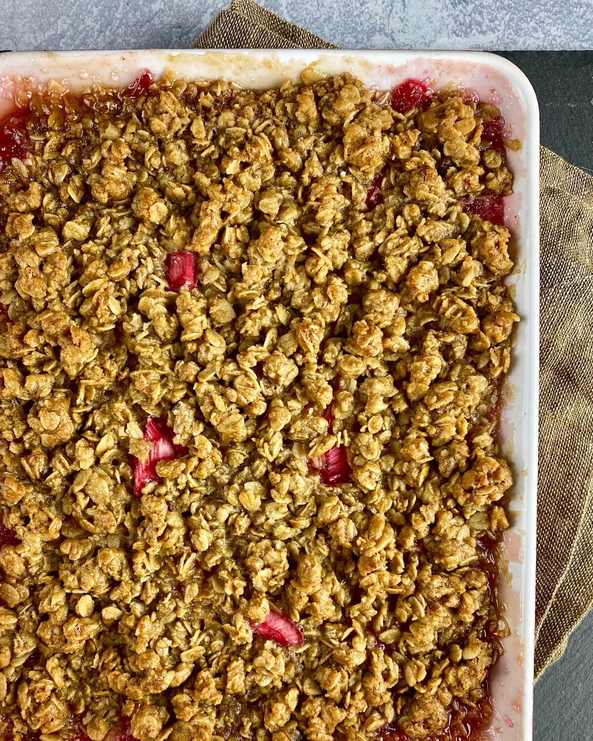 baked rhubarb crisp in dish on towel