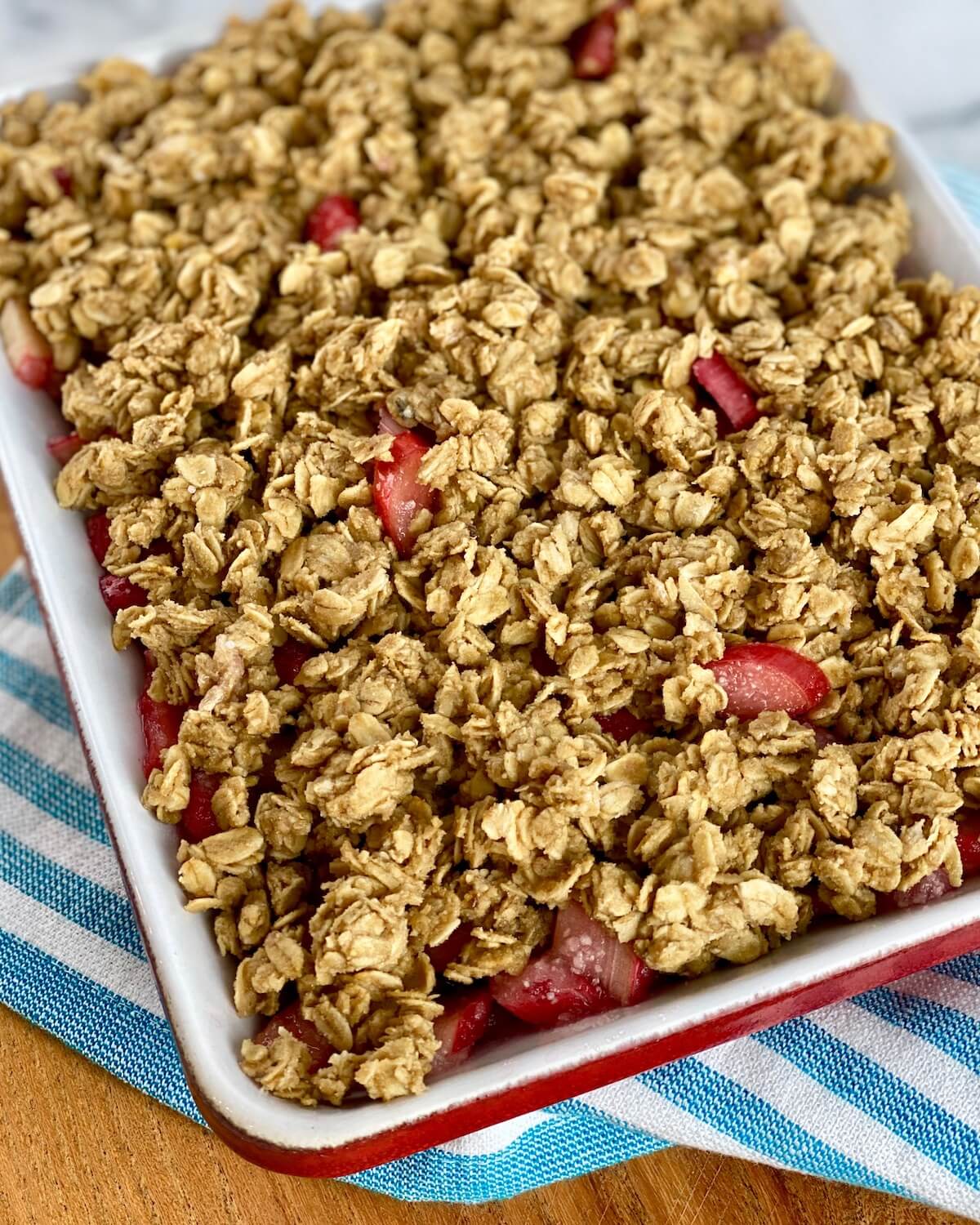 rhubarb crisp with oat topping ready to go in the oven