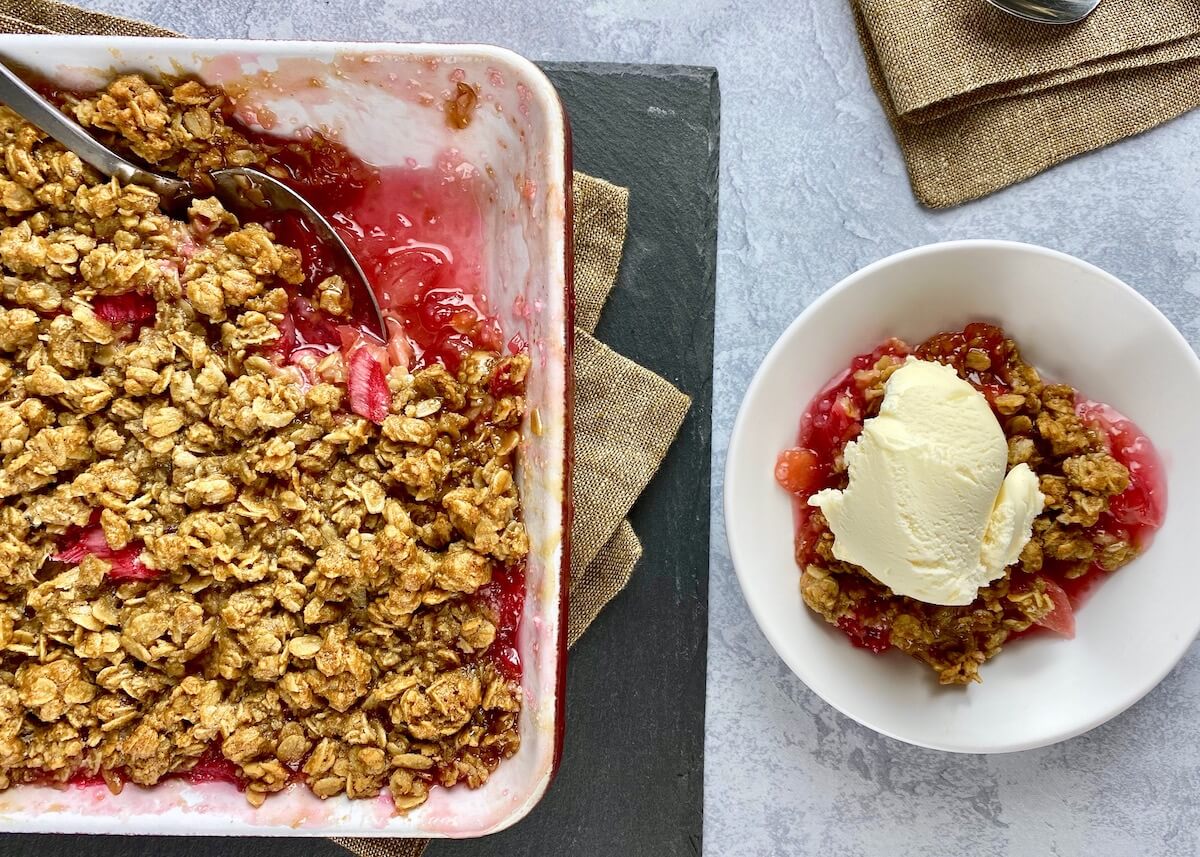 rhubarb crisp being served with ice cream