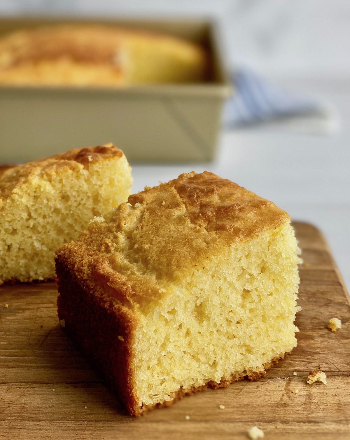 tall slice of moist cornbread on board