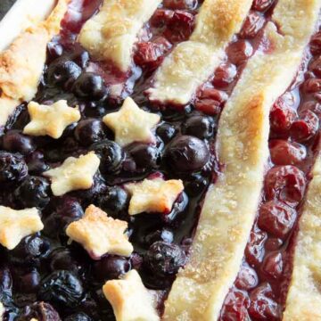 blueberry and cherry desseret with star and stripe pastry on top