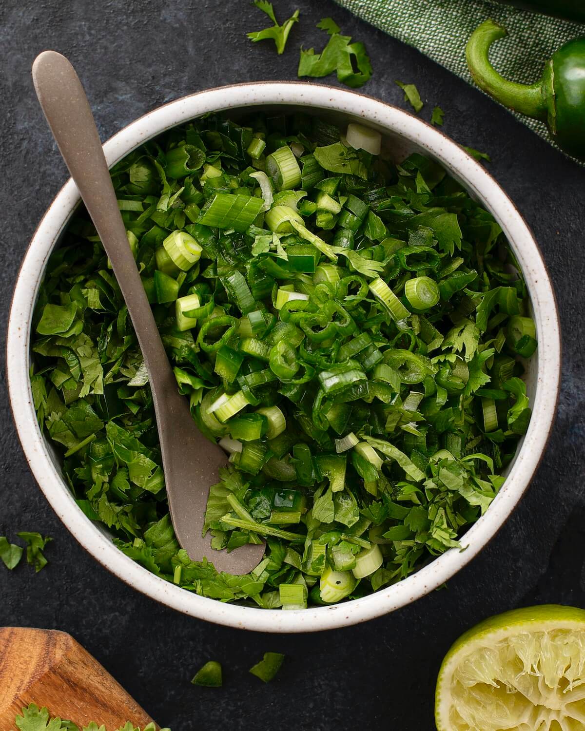 green cilantro salsa recipe with scallions close up in bowl