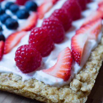 slice of cookie cake on a wooden cutting board