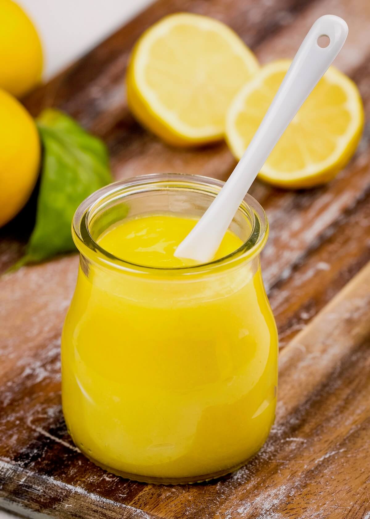lemon curd in jar with spoon in the jar