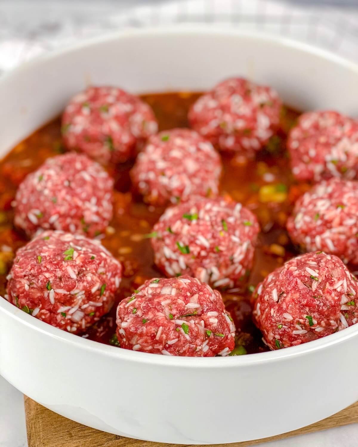 beef meatballs in baking dish ready to go in the oven