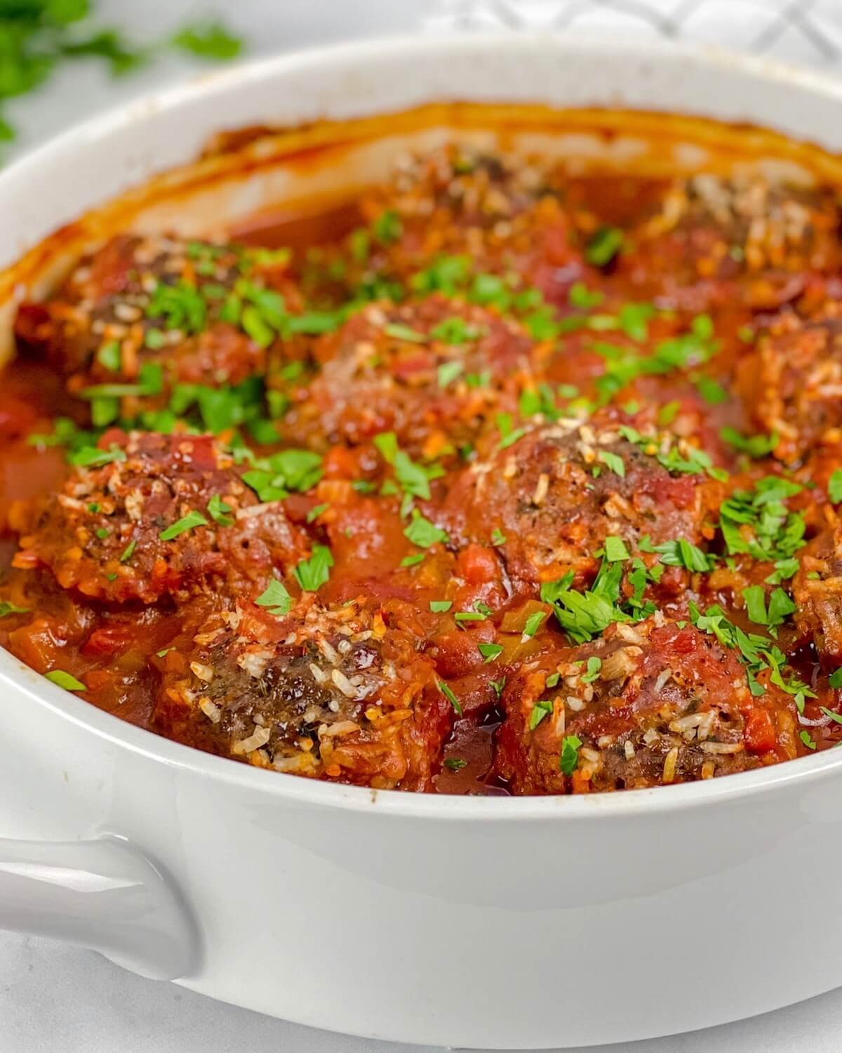 porcupine meatballs with rice in tomato sauce with parsley