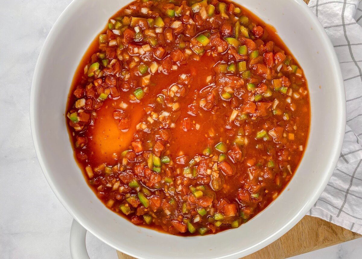 tomato sauce with green peppers in a baking dish