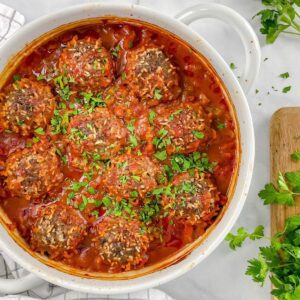 feature image of porcupine balls with rice cooked inside in tomato sauce