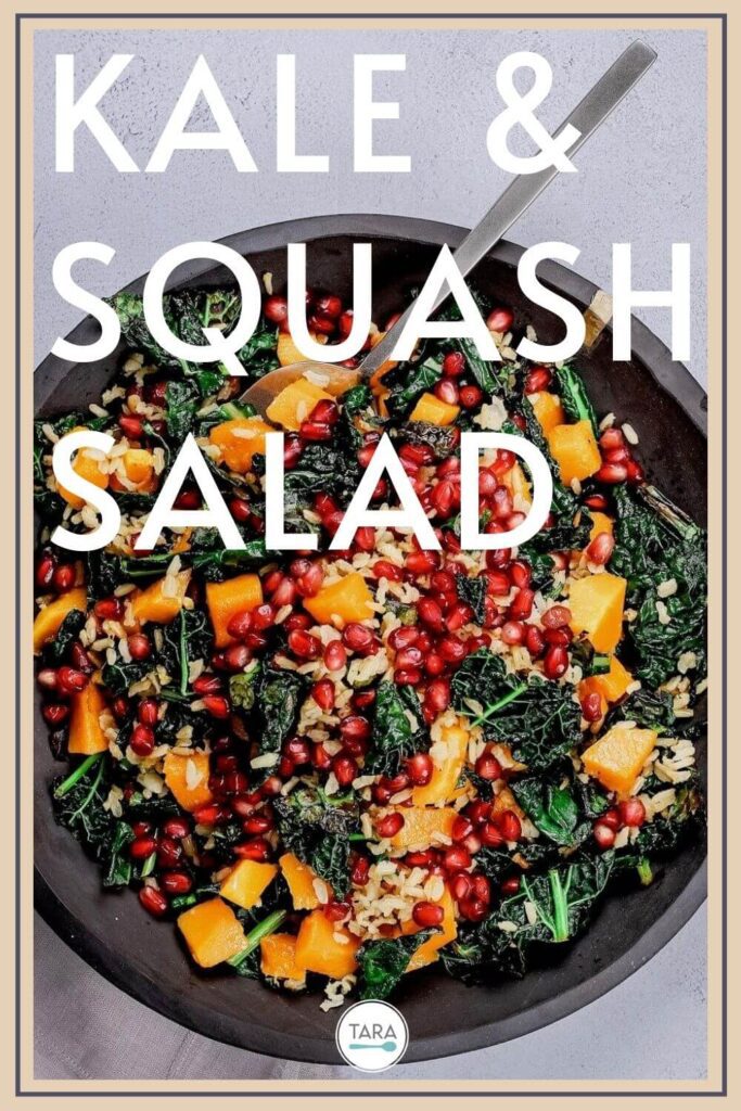 pin for kale and squash salad with brown rice and pomegranates in a slate bowl