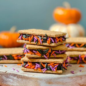 feature image of graham cracker cookies with chocolate frosting and Halloween sprinkles