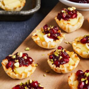tartlets with brie and onions with pomegranates