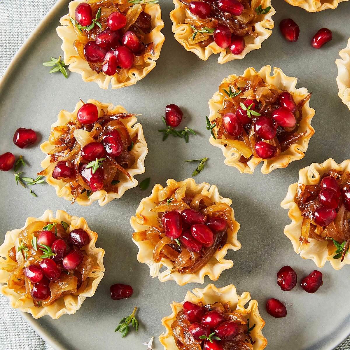 French Onion Phyllo Cups: Tartlets with Gruyere and Pomegranates image