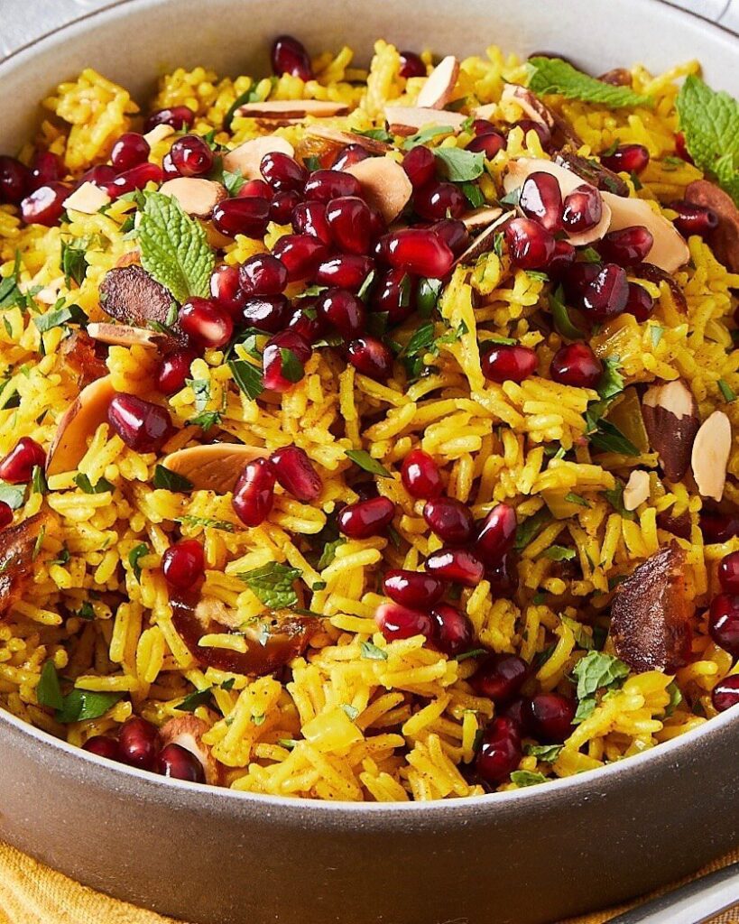 Mediterranean rice with dates and pomegranates in a brown dish