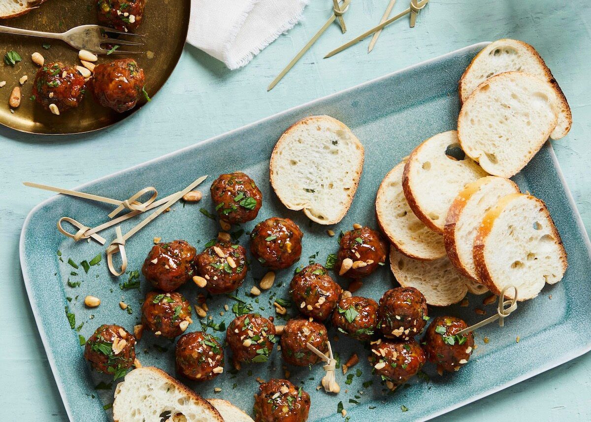 Moroccan spiced meatballs with bread on a platter