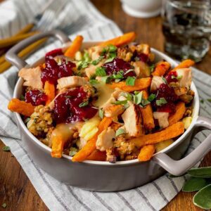 looking into baking dish with sweet potato fries and gravy with cheese