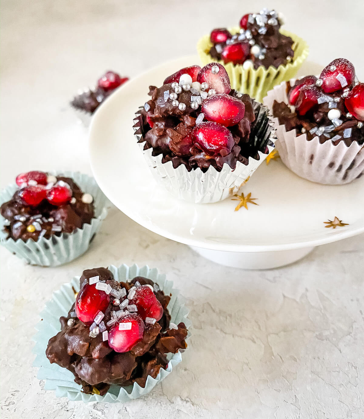 coconut and granola chocolate clusters with pomegranate