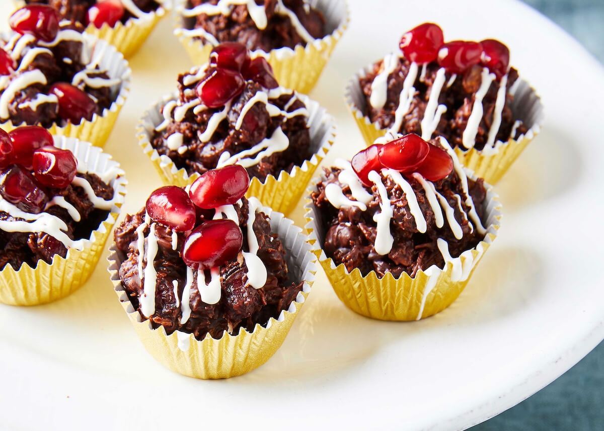 pomegranate and chocolate candy in gold foil cups