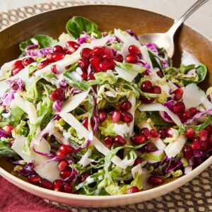 shaved brussels sprouts, cheese, purple cabbage and pomegranate salad