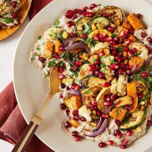 roasted eggplant dip with vegetables and pomegranates