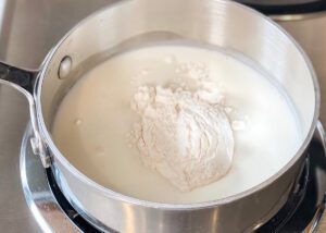 Mixing flour and milk in pan for tangzhong