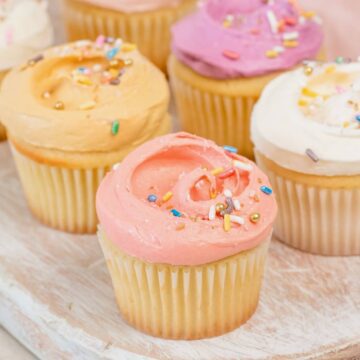 close up on pastel frosted cupcakes with sprinkles
