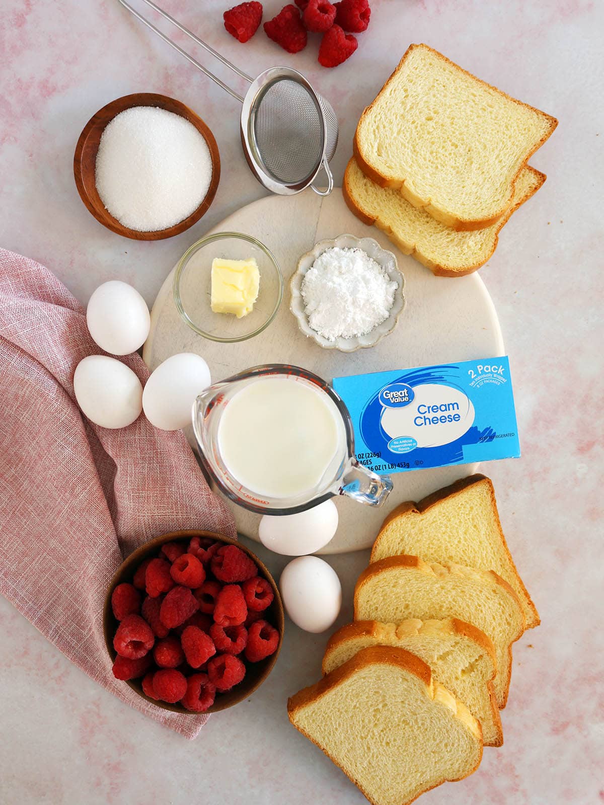 Ingredients needed to make raspberry bread pudding.