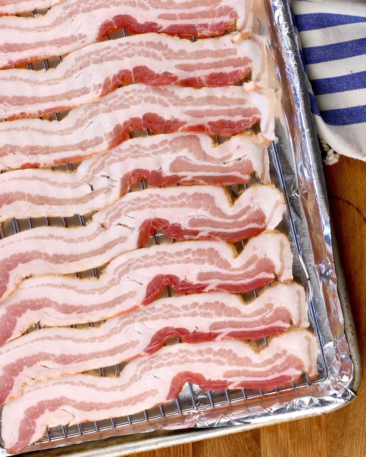 bacon in a pan ready to be cooked