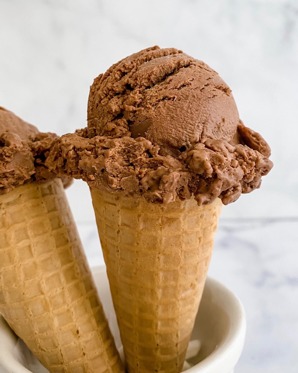 close up of chocolate ice cream scoop in cone