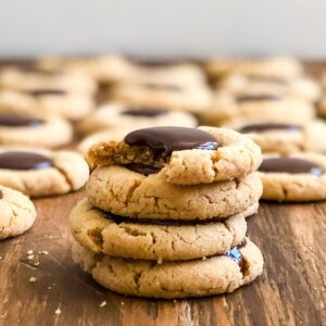 close up of cashew blossom cookies with melty chocolate