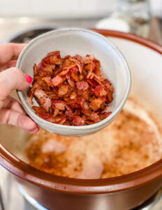 crisped bacon removed from pan into a bowl