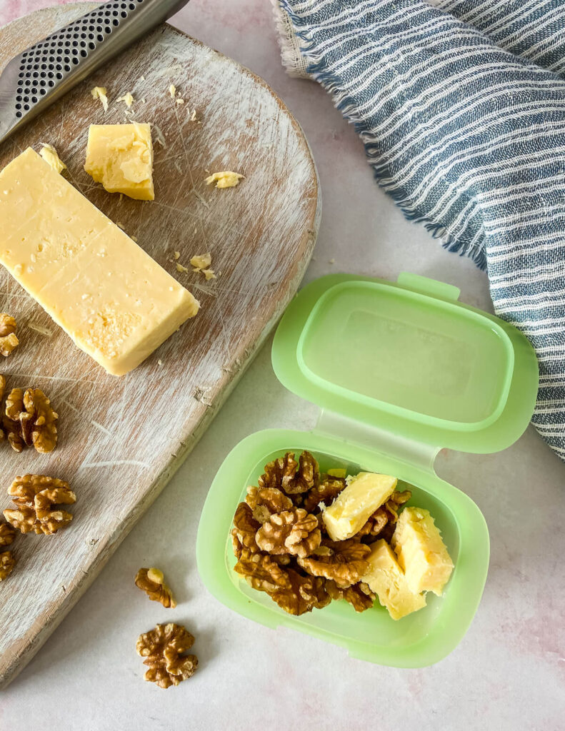 cheese and walnut snack in silicone container