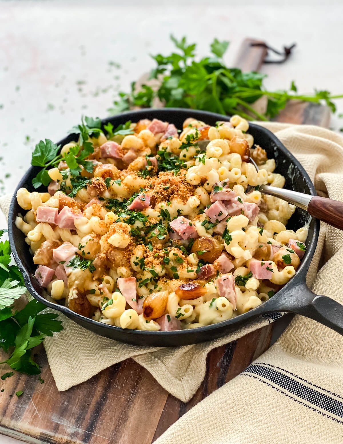 spooning mac and cheese with ham