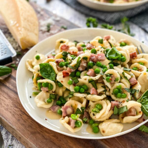 Italian peas and ham pasta close up