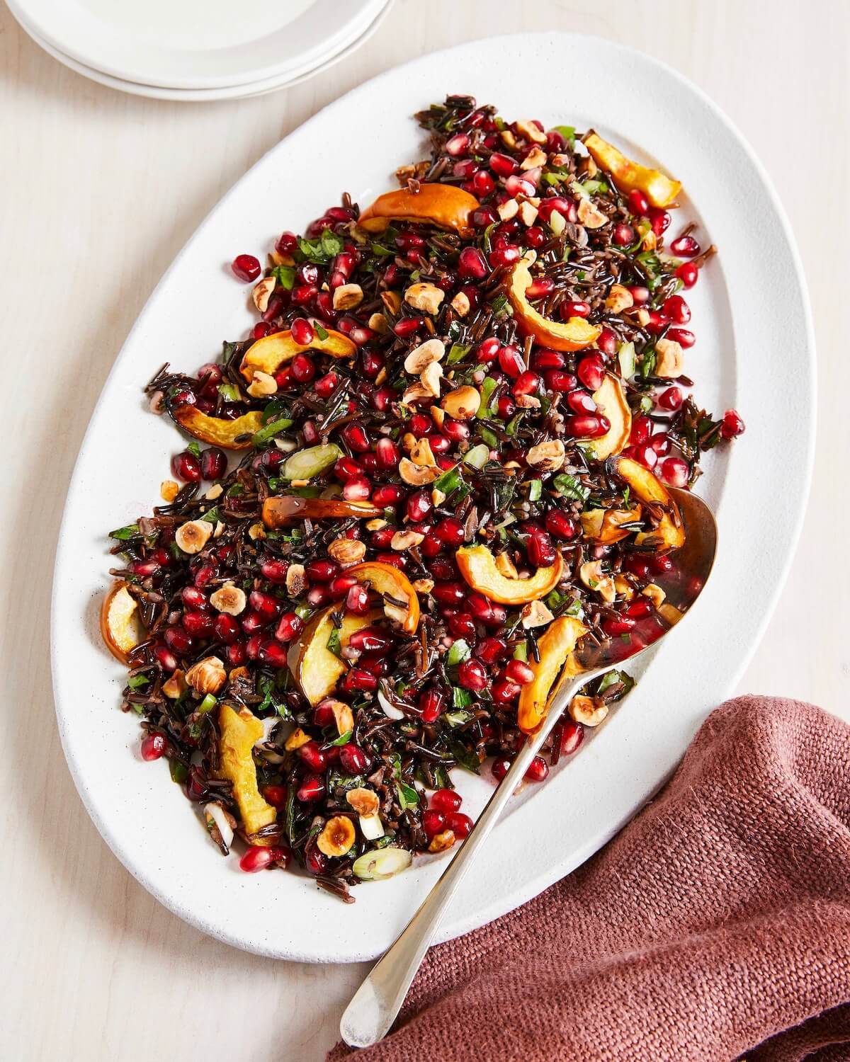platter of rice salad with roasted squash and pomegranate arils