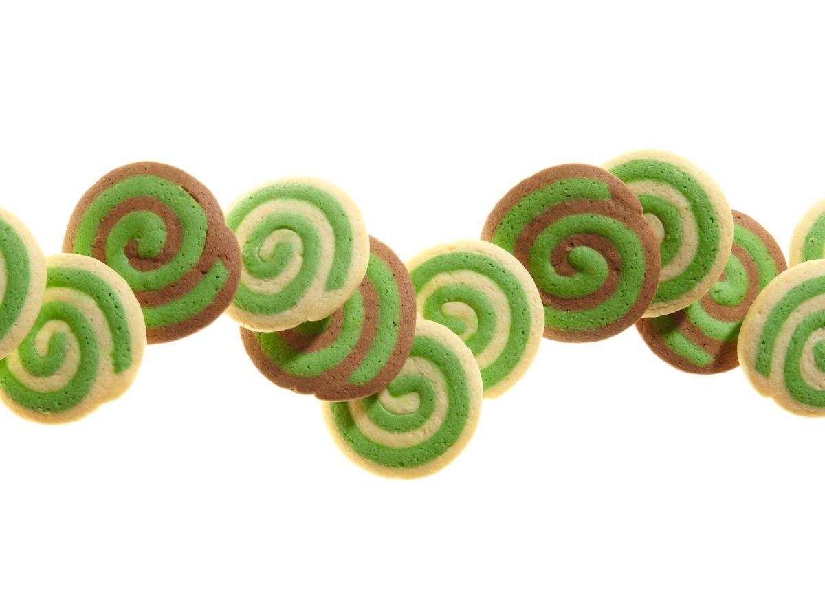 white green and chocolate cookies on white surface