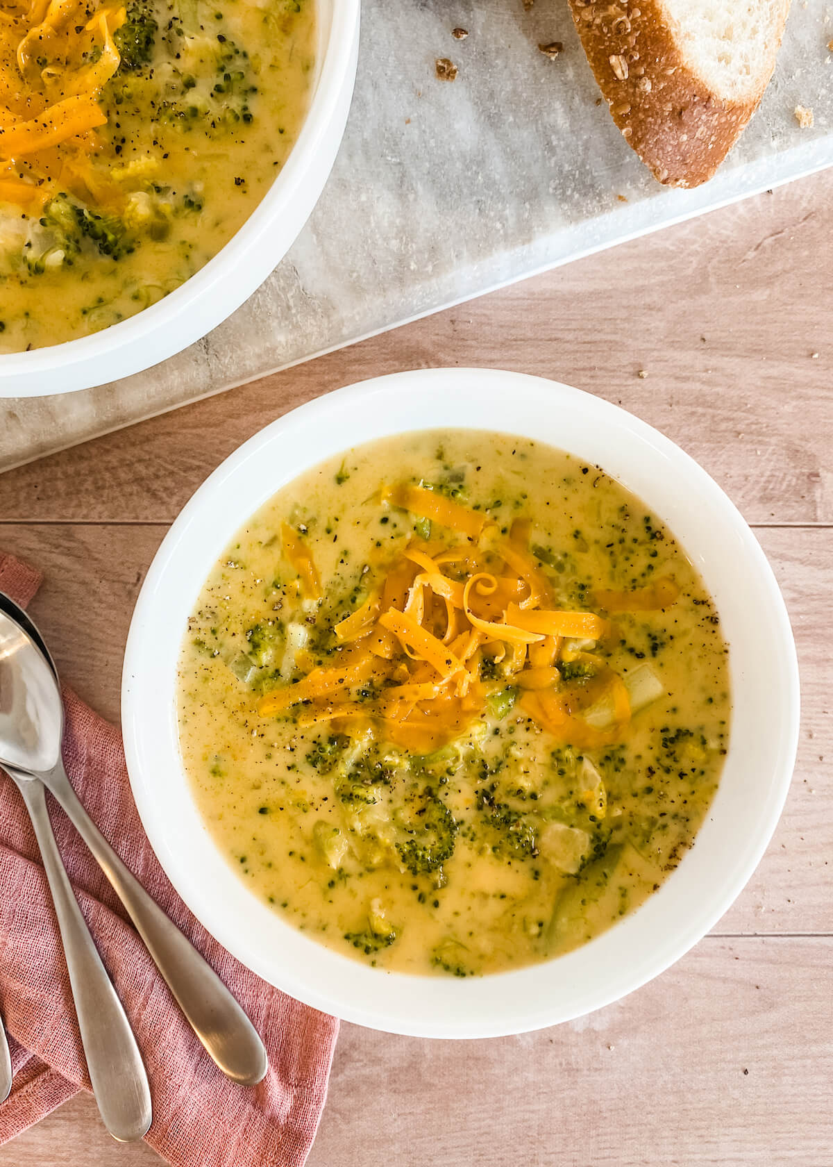 bowl of broccoli cheese soup with bread