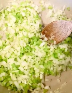 onions and celery in pan