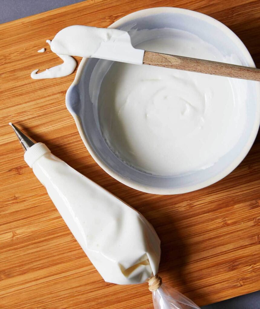 white royal icing with meringue powder in a bowl