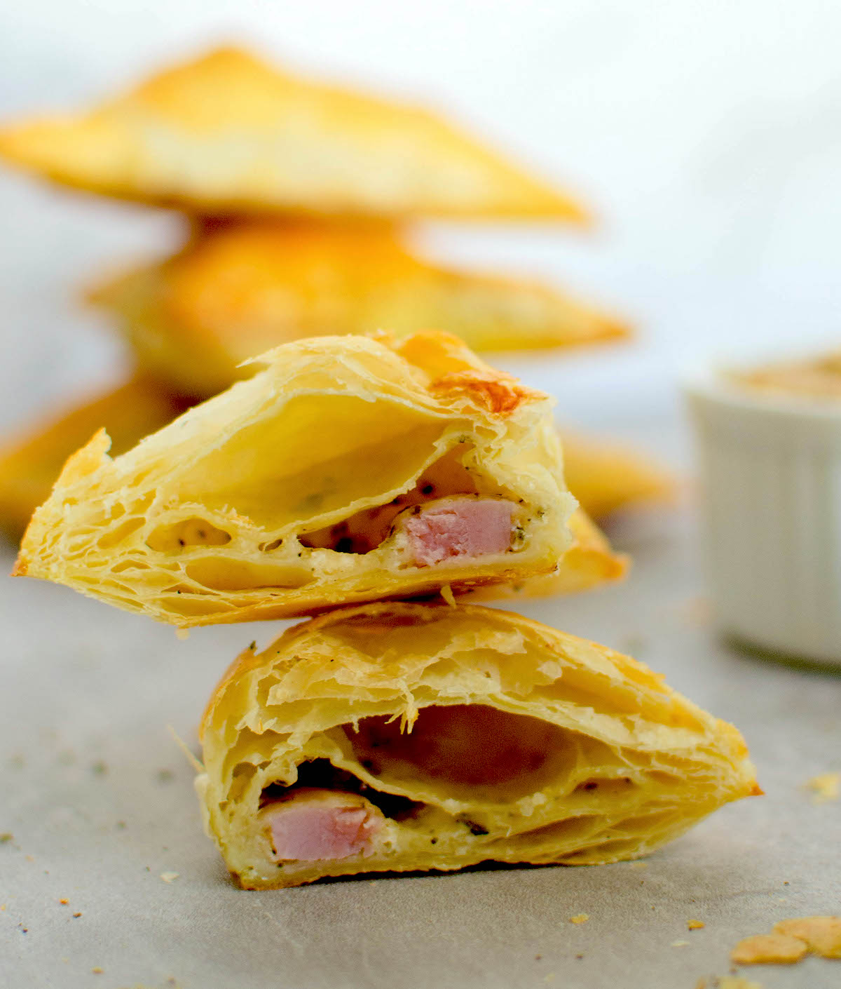 close up on cut ham and cheese puff pastry turnover