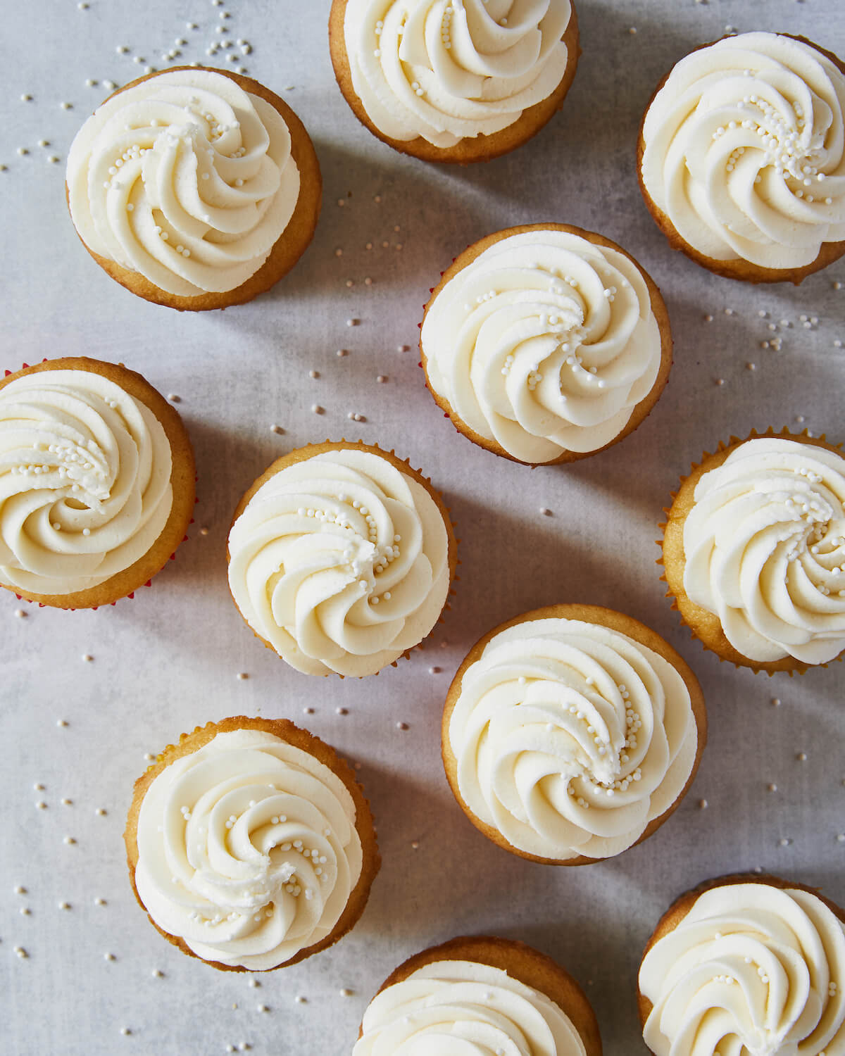cupcakes with piped vanilla frosting